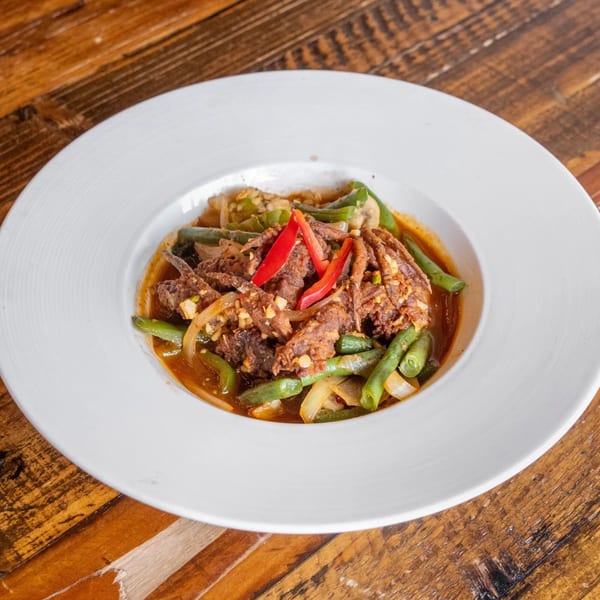 Siwa Thai Restaurant's spicy stir-fried beef with green beans, onions, and red chili peppers.